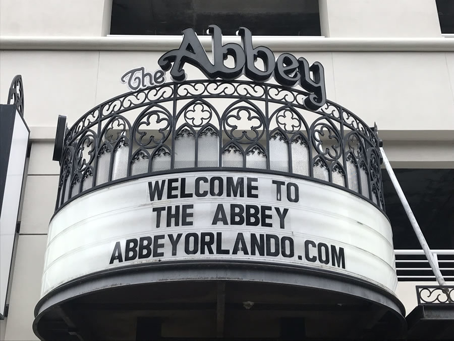the abbey black and white sign